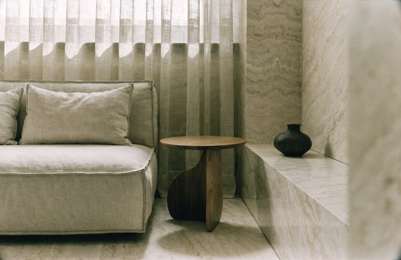 A living space finished in Crema Marfil marble